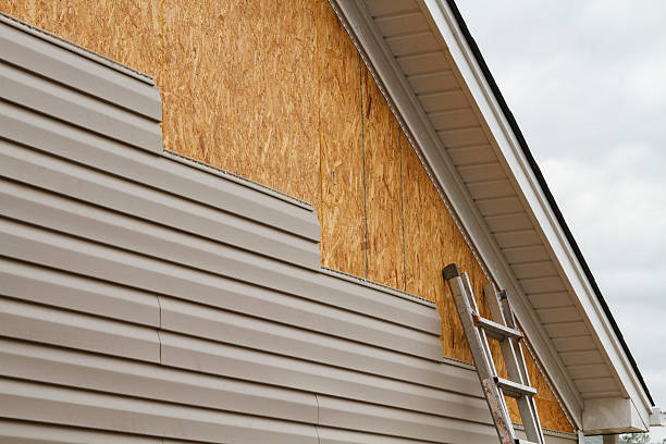Professional Vinyl Siding technician working in Norwood, MA